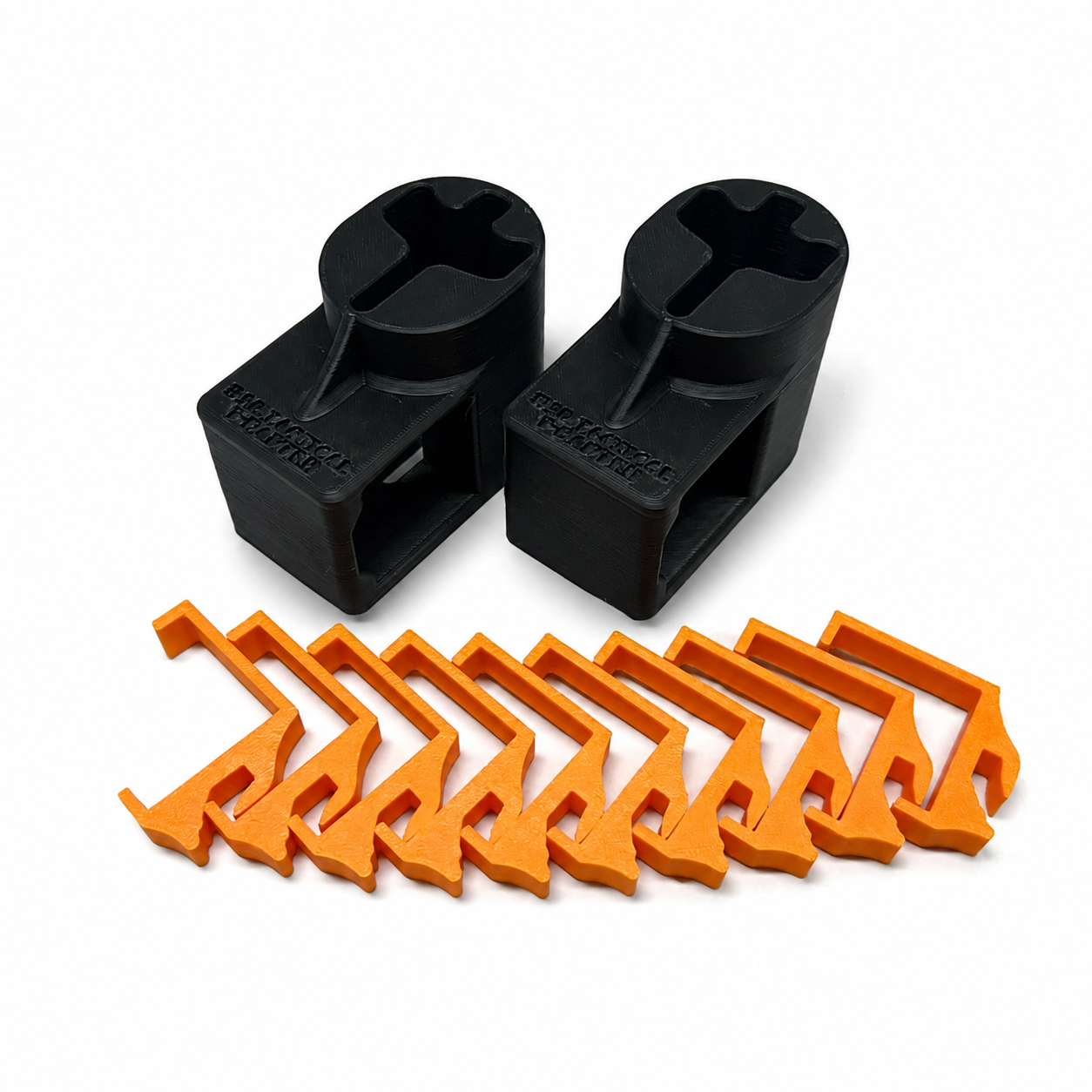 Orange and black plastic clips on a white background
