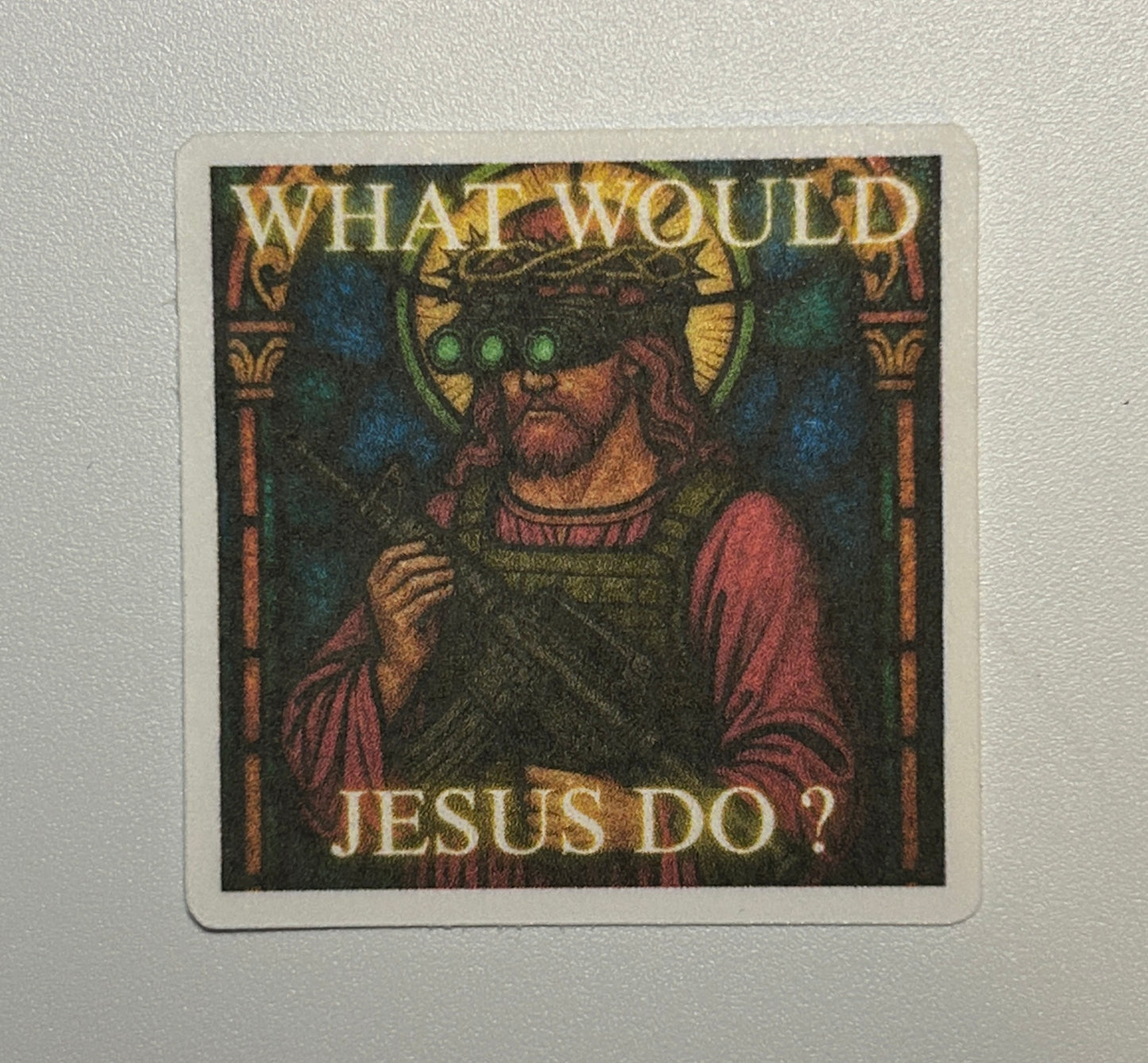 Square sticker featuring an illustrated human figure in a stained-glass art style with text elements on a dark, decorative background.