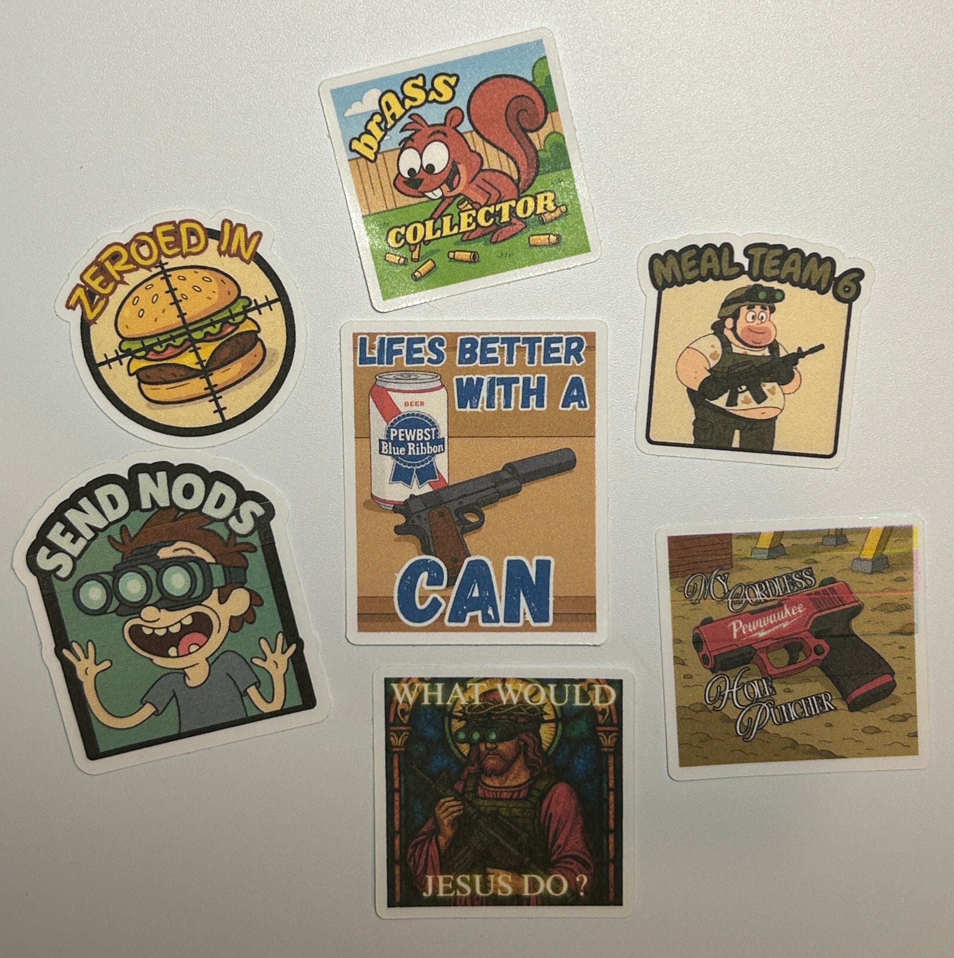 Sticker pack displayed on a white background featuring multiple illustrated stickers with cartoon-style characters, text designs, and graphic artwork arranged in a group.